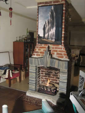 Finished hearth and mantle enhances the gas fireplace