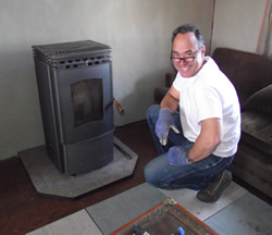 Image of a small pellet stove warming a cozy spot